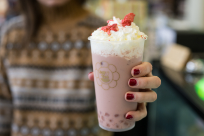 Lang holding a dessert drink.