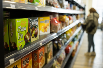 Asian snack foods on shelves.
