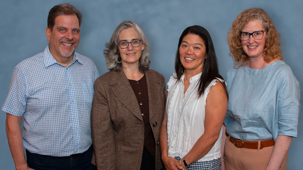 OPENING DOORS: The Warner School’s Michael Occhino, Kimberly Fluet, Nahoko Kawakyu O’Connor, and RIT’s Sharon Mason lead the AURA Research Hub, studying students across 10 partner universities. (URochester photo / Michael Capehart)