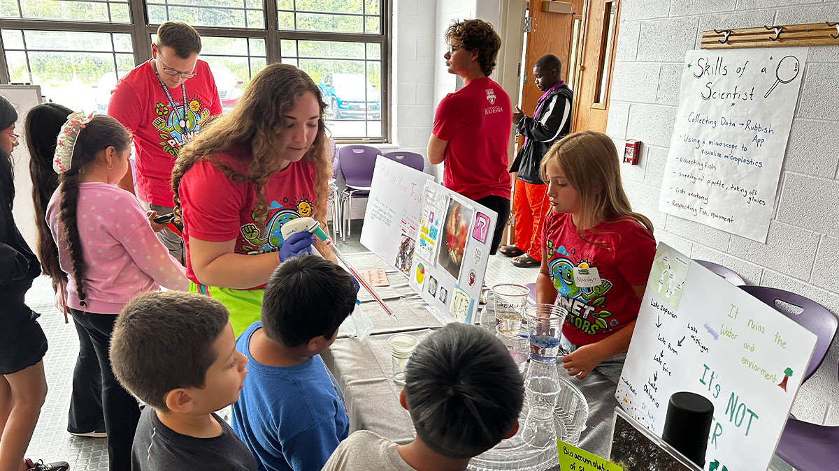 Master’s student Claire Tuttle ‘26W (MS), a chemistry teacher in training, engages with Sodus students about microplastics