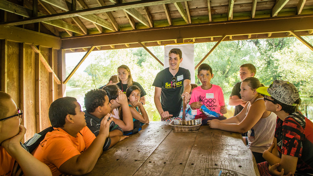 James Kostka ’18W (MS) and Sidney Line ’18W (MS) lead a science investigation on invasive species with Sodus students.