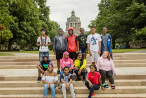 Group of Horizons older students in a group photo on the steps in front of Rhees Library. 