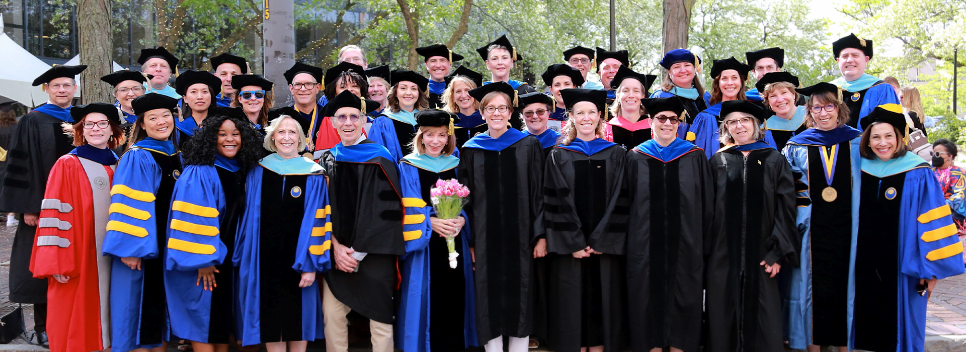 Group photo of Warner faculty at Commencement 2023