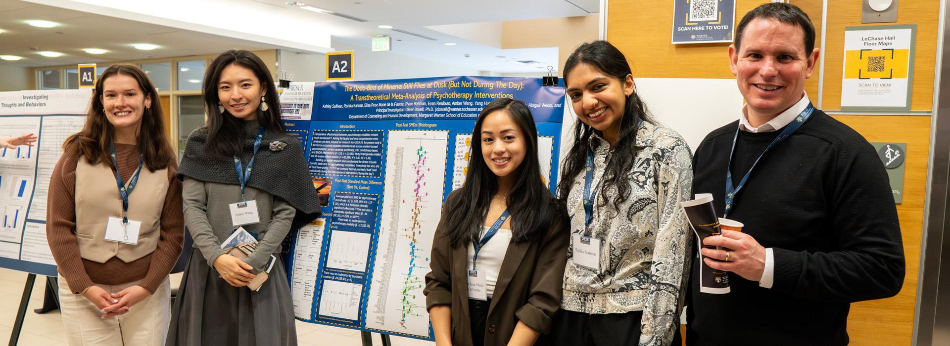 Warner Students at 2025 Research Days standing in front of their poster presentation