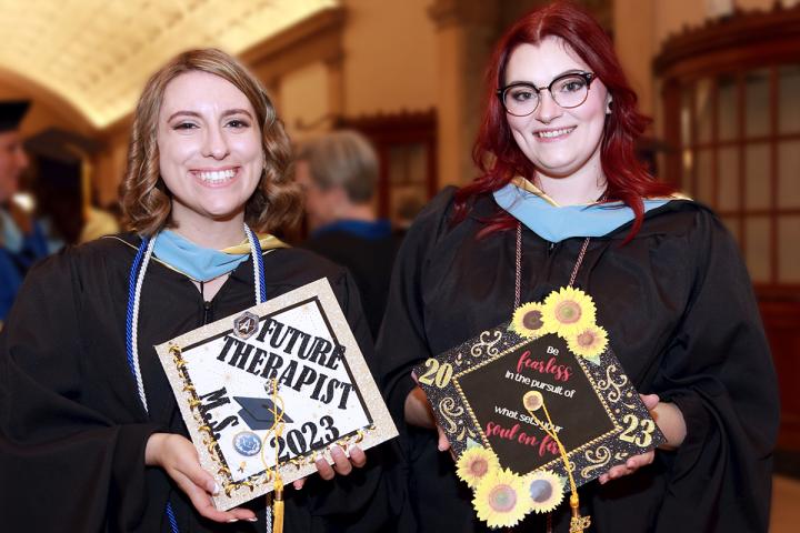 Two Warner students celebrating graduation